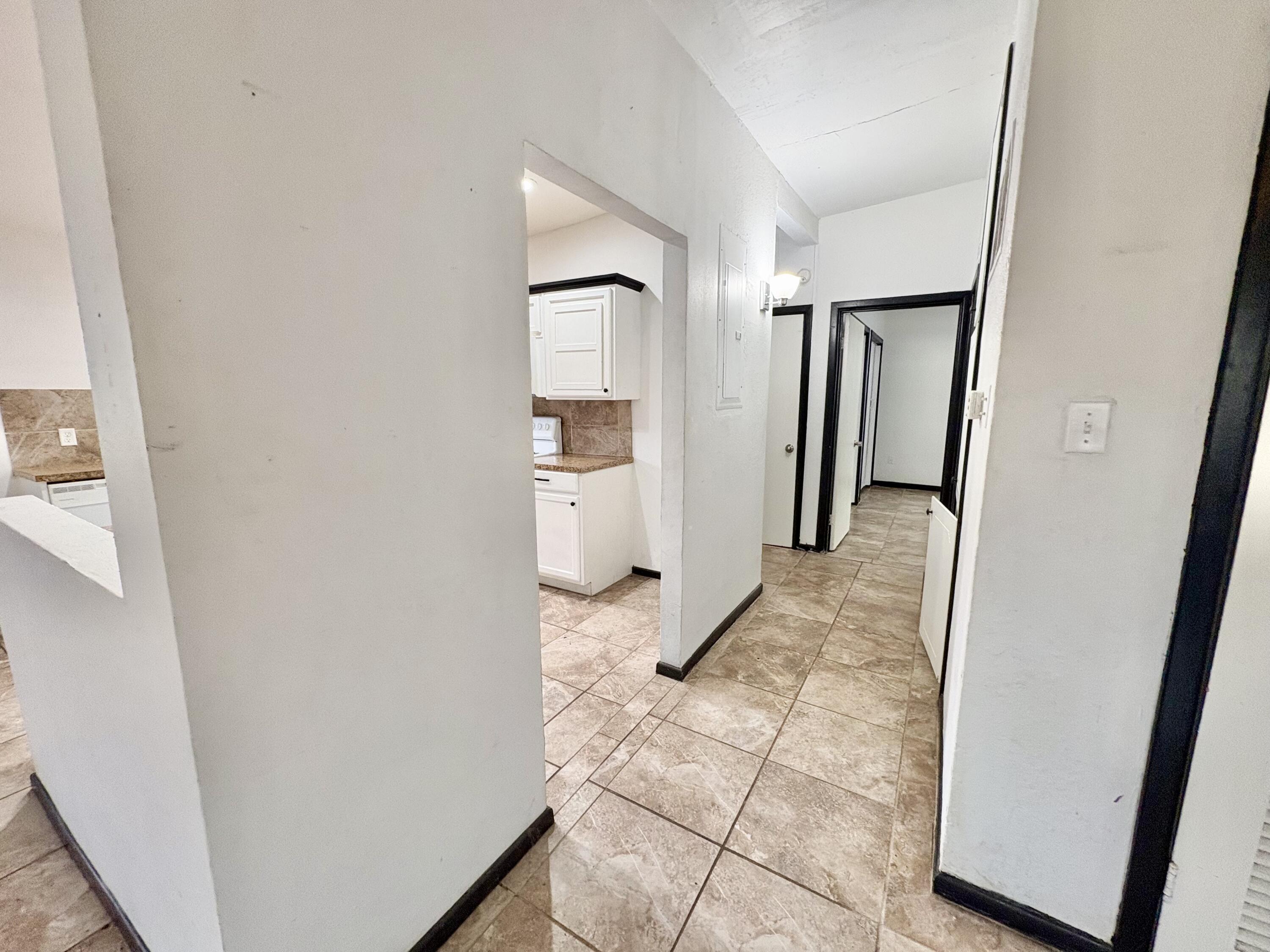 4403 44th Street Lubbock, TX 79414 - Photo 11 of 25 a view of a hallway with shelves