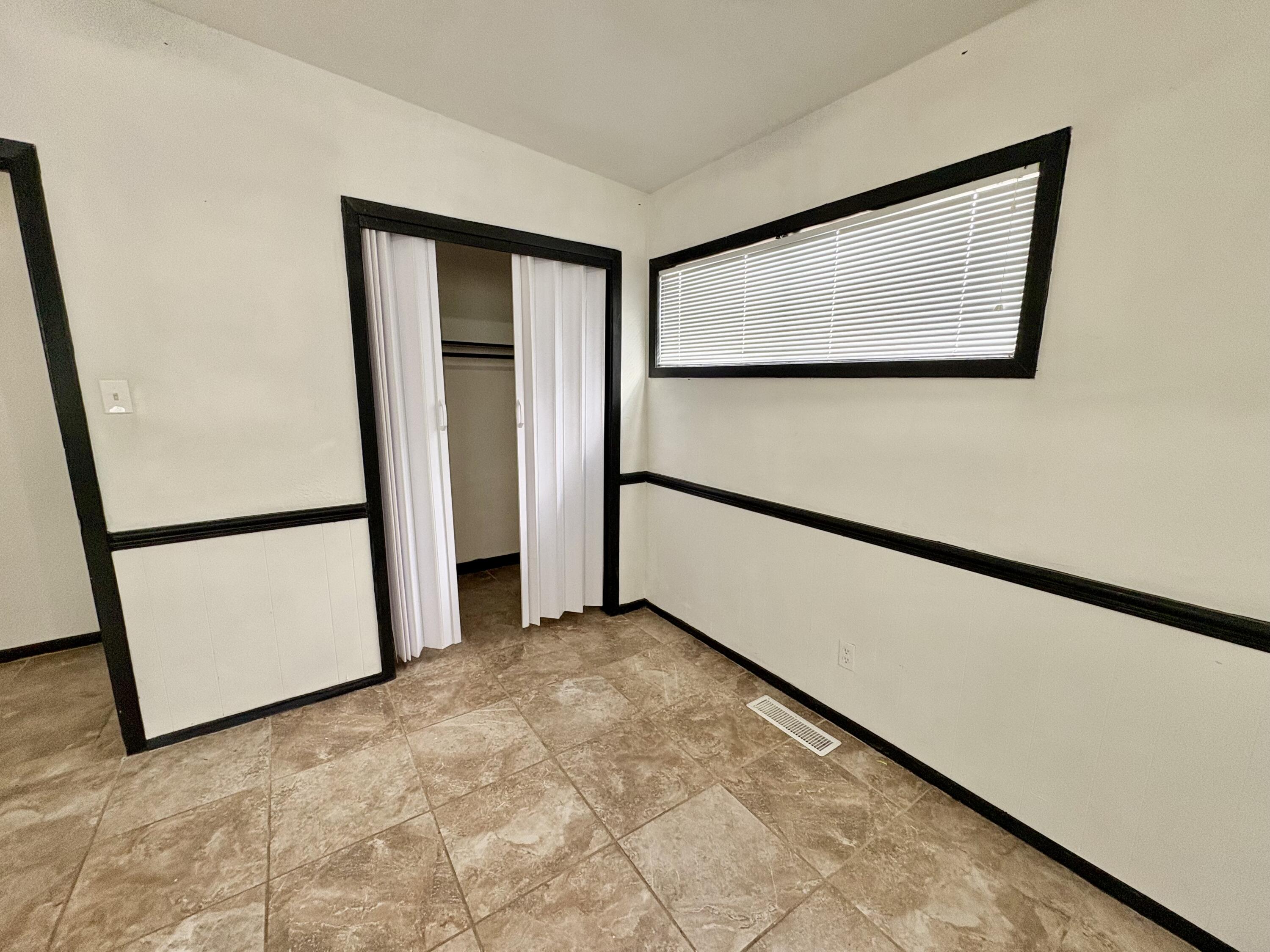 4403 44th Street Lubbock, TX 79414 - Photo 13 of 25 a view of empty room with wooden floor