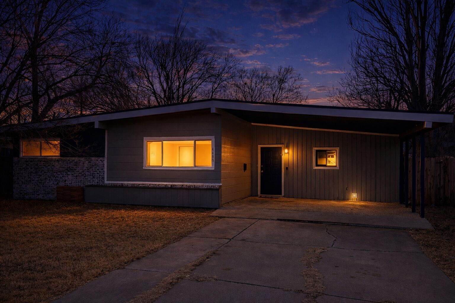 4403 44th Street Lubbock, TX 79414 - Photo 2 of 25 a front view of a house with a yard