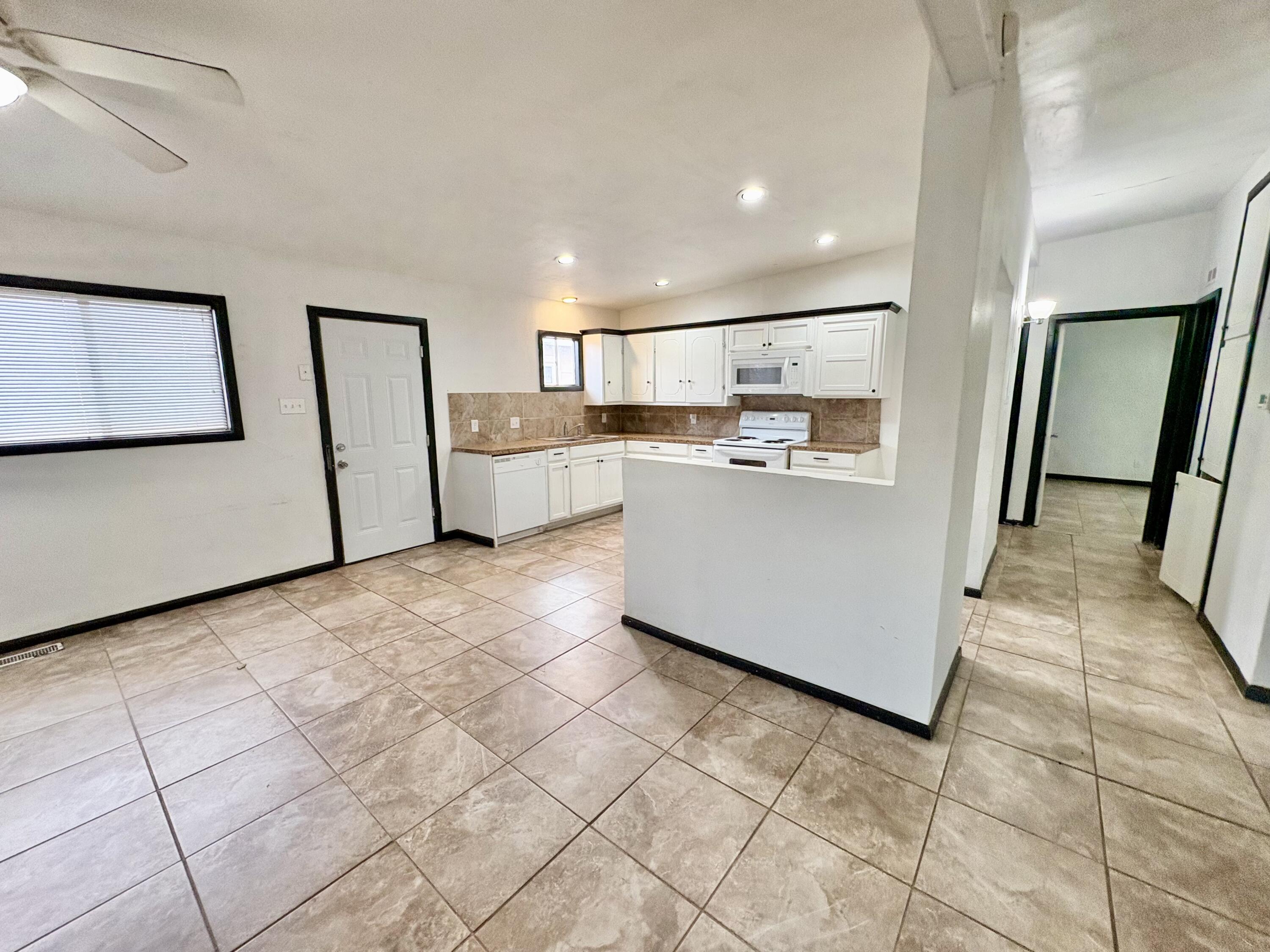 4403 44th Street Lubbock, TX 79414 - Photo 6 of 25 a view of kitchen with stainless steel appliances cabinets