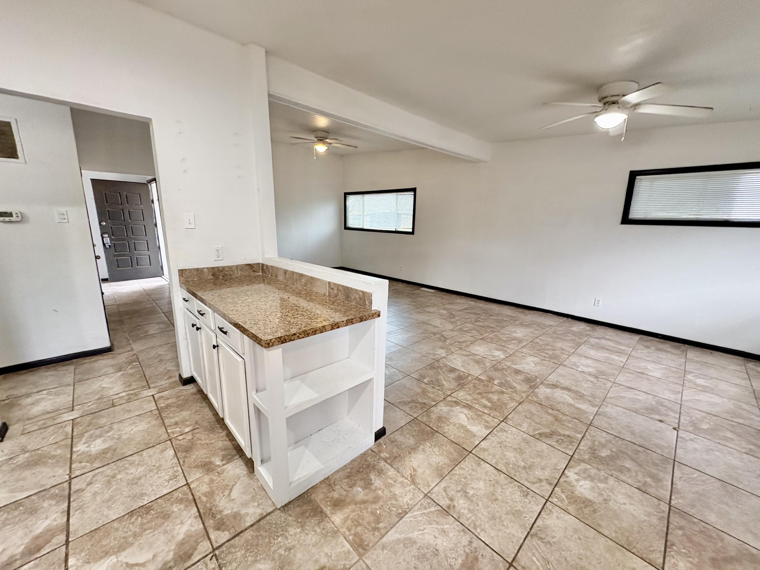 4403 44th Street Lubbock, TX 79414 - Photo 9 of 25 a view of a hallway with washer and dryer