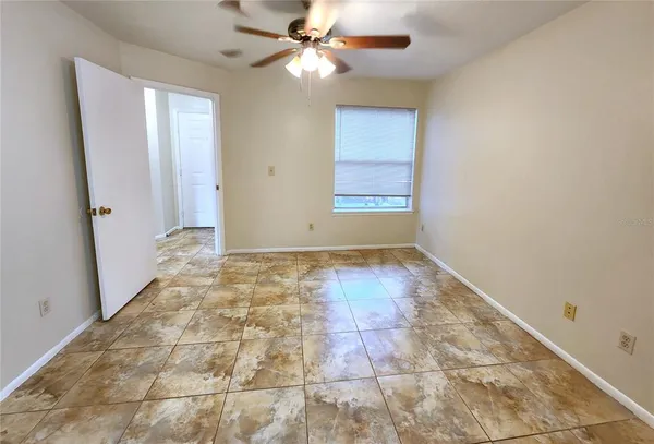 a view of an empty room and window