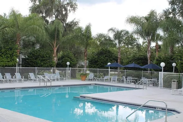 a view of a swimming pool with a patio