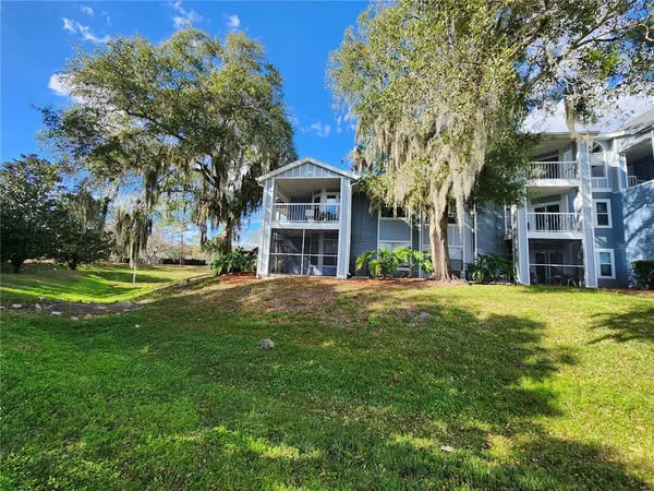 a front view of a building with a garden