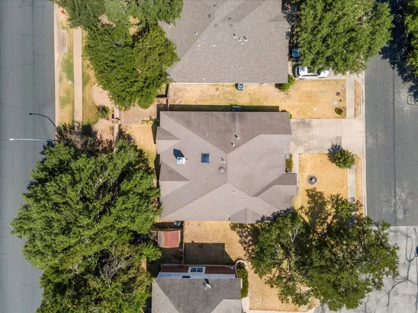 an aerial view of residential houses with outdoor space