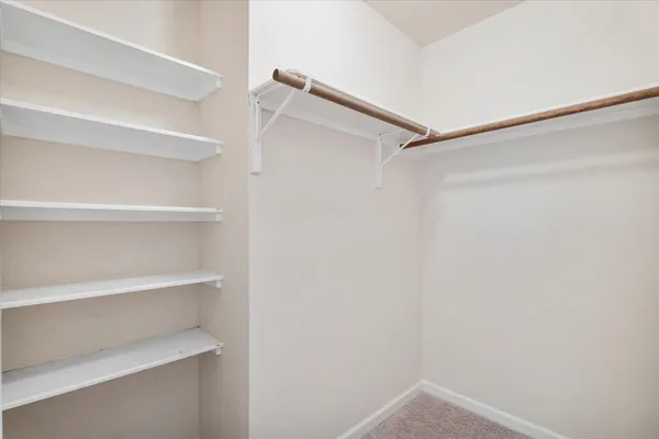 a view of an empty walk in closet