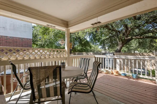 a view of a chairs and table in the balcony