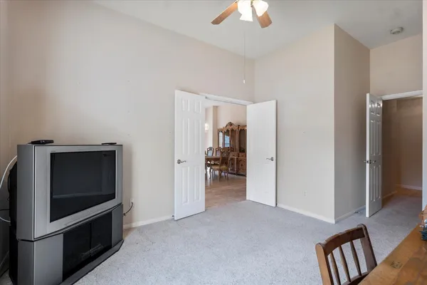 a view of livingroom with hardwood floor and a ceiling fan