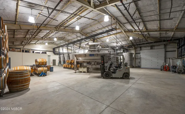 a view of parking garage with cars