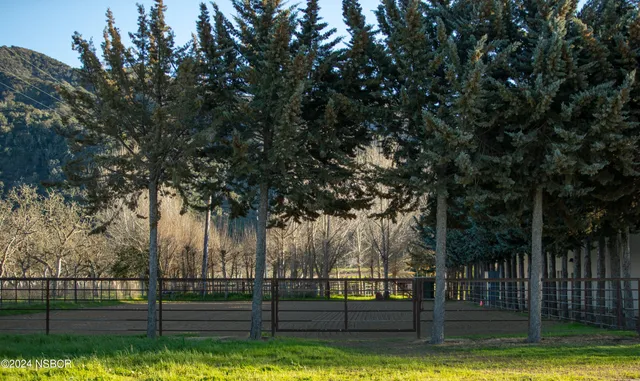 a view of a large house with a large pool