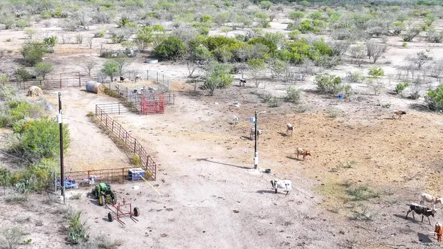 a view of a chair and table in the back yard