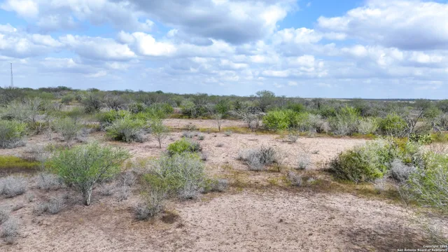 a view of a lake with a house in background