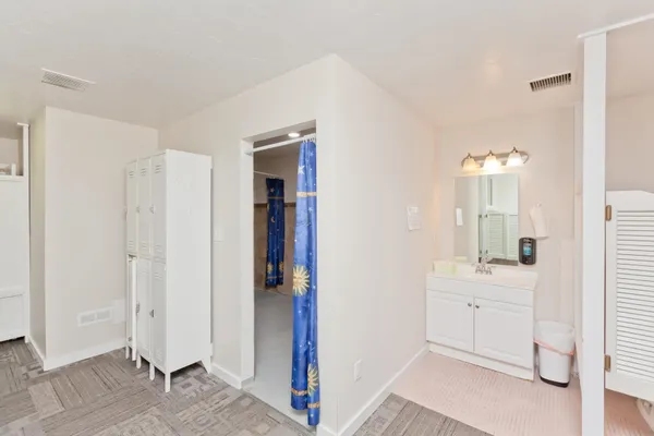a view of a kitchen with a sink and cabinet