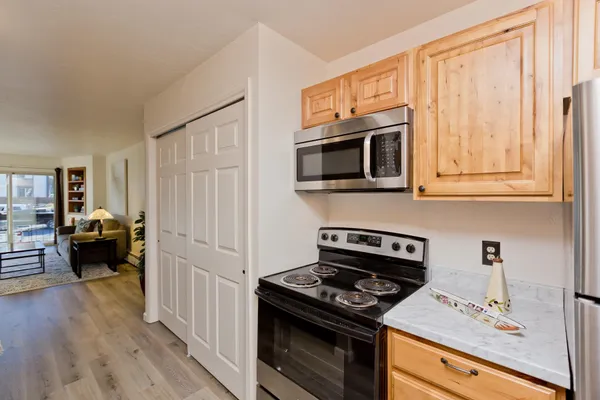a kitchen with a stove and a microwave