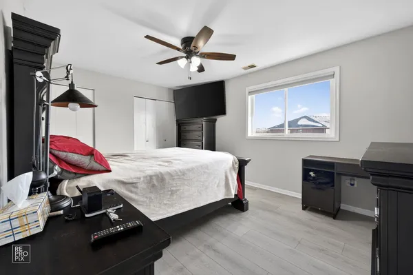 a bed room with a bed and a window