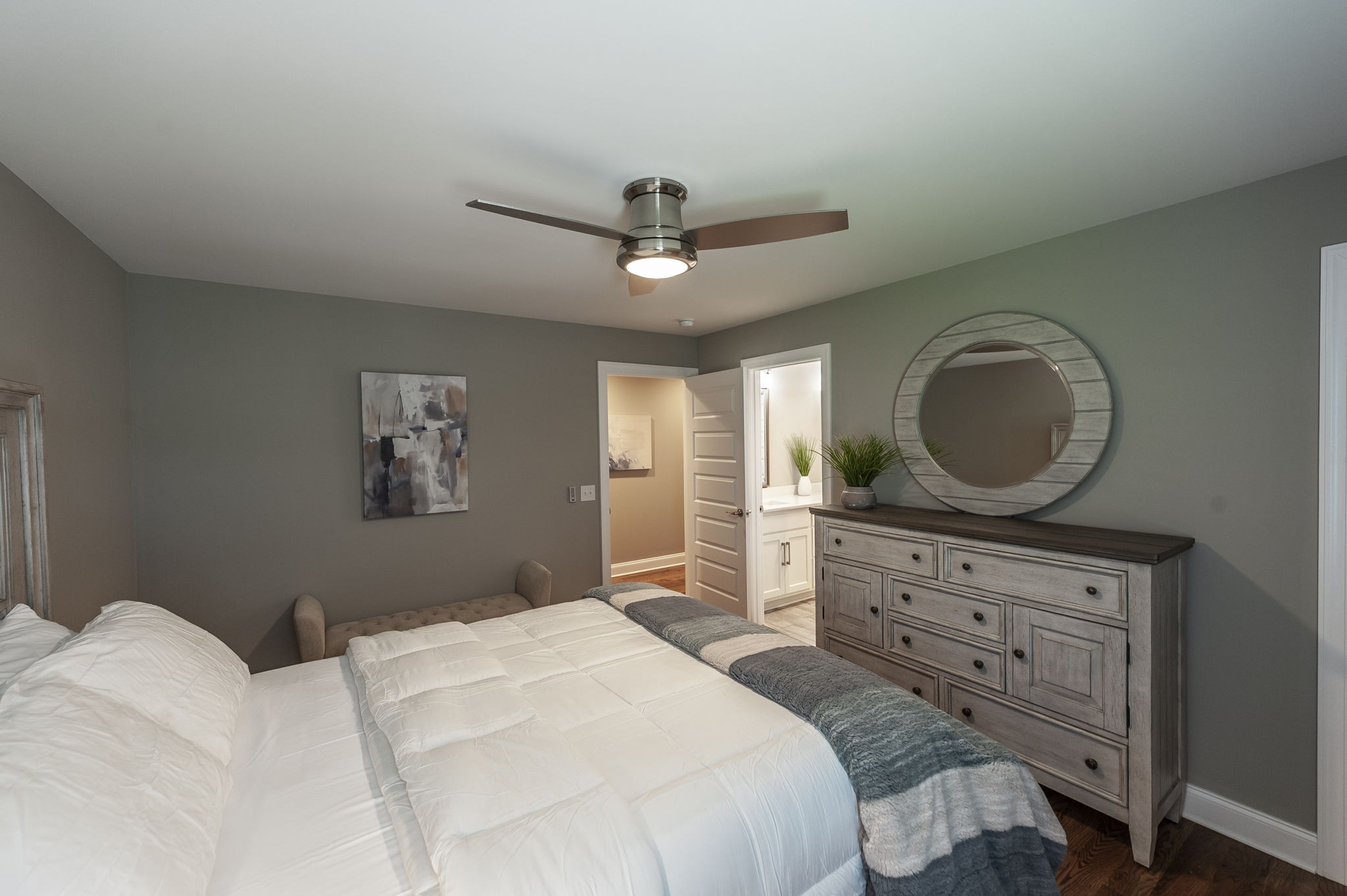 872 Douglas Bend Road Gallatin, TN 37066 - Photo 37 of 80 a bedroom with a bed a dresser and a chandelier