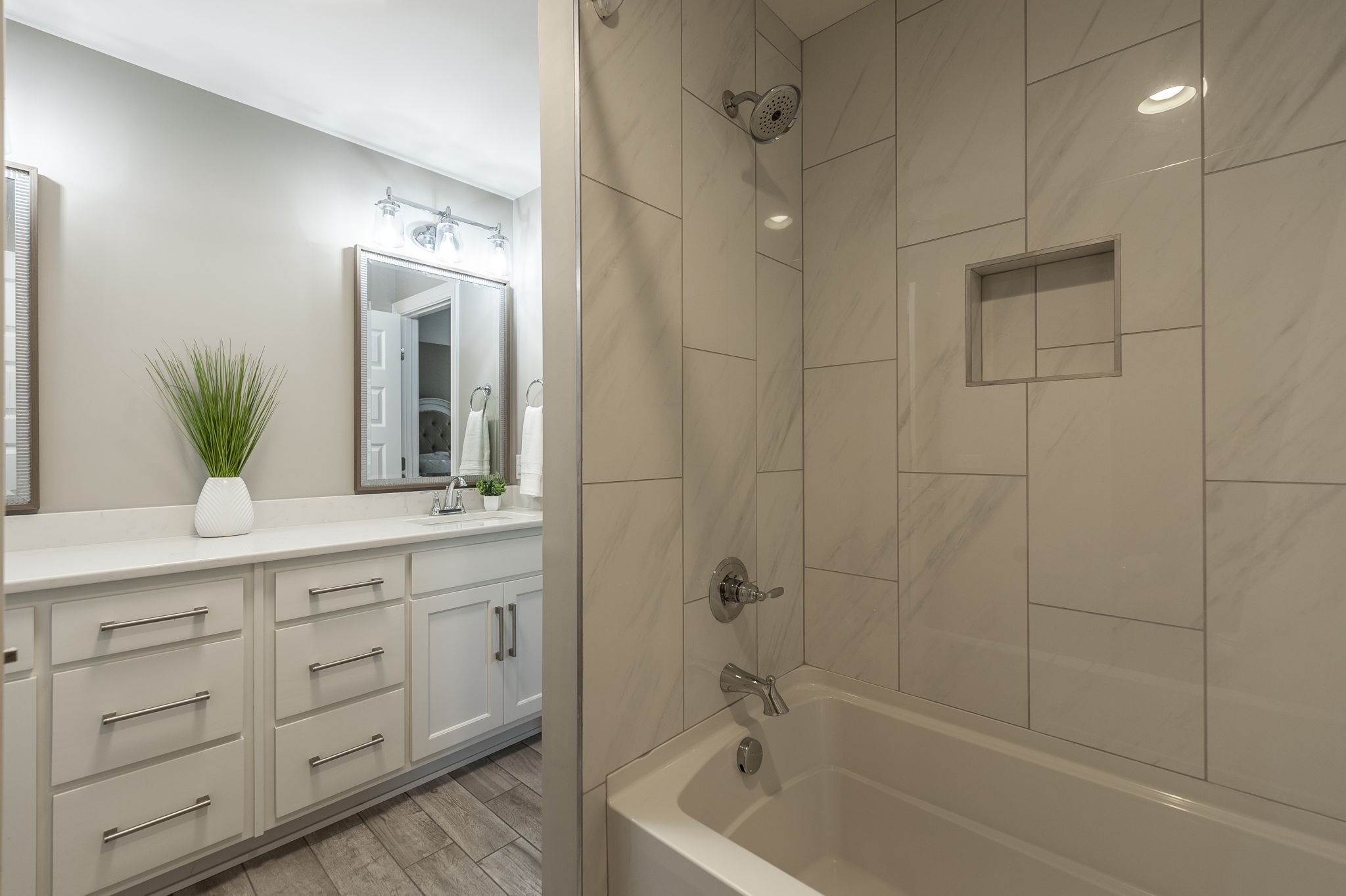 872 Douglas Bend Road Gallatin, TN 37066 - Photo 39 of 80 a bathroom with a double vanity sink a large mirror and shower