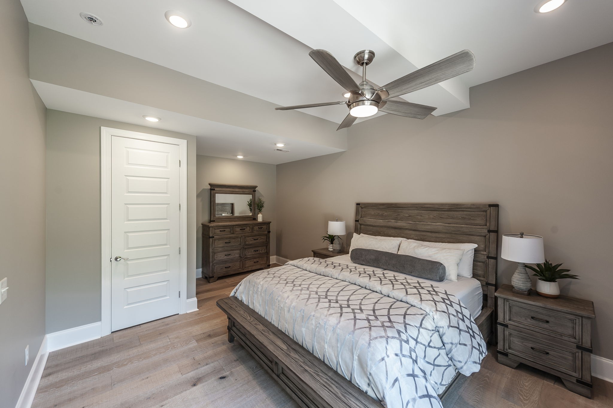 872 Douglas Bend Road Gallatin, TN 37066 - Photo 60 of 80 a bedroom with a large bed and a ceiling fan