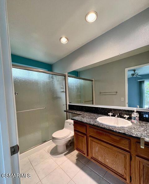 486 Algonquin Drive Simi Valley, CA 93065 - Photo 11 of 13 a bathroom with a granite countertop sink a toilet a mirror and shower