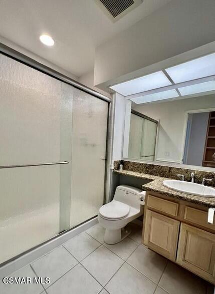 486 Algonquin Drive Simi Valley, CA 93065 - Photo 7 of 13 a bathroom with a granite countertop sink a toilet a mirror and shower