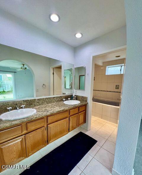 486 Algonquin Drive Simi Valley, CA 93065 - Photo 9 of 13 a spacious bathroom with a granite countertop sink and a mirror