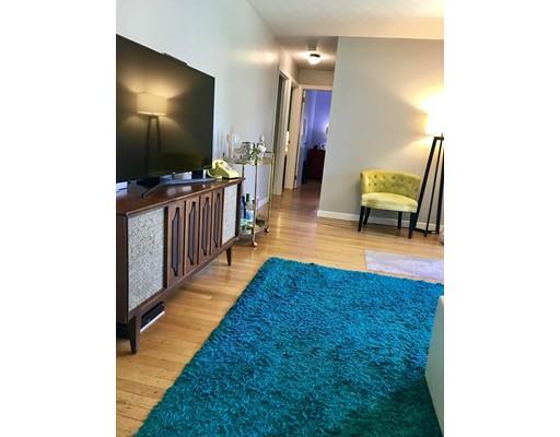94 Brookside Road Rockland, MA 02370 - Photo 11 of 22 a living room with furniture and a flat screen tv