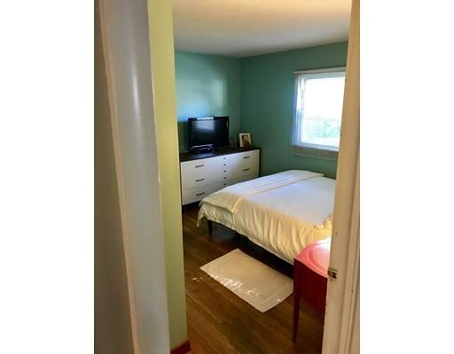 94 Brookside Road Rockland, MA 02370 - Photo 16 of 22 a bedroom with a bed and a television in it
