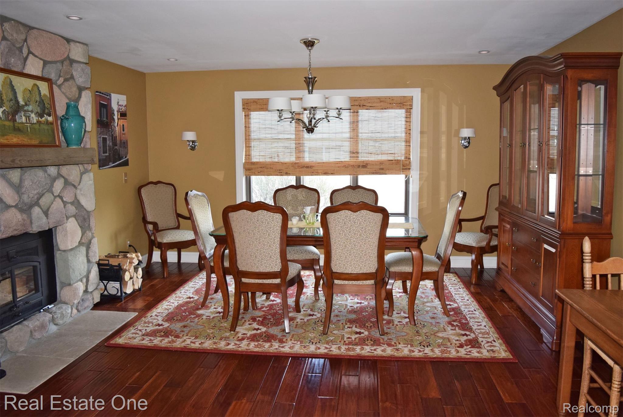 2706 Powderhorn Ridge Road Rochester, MI 48309 - Photo 10 of 48 They have put their large dining room furniture in the typically family room area. The Teak flooring continues in this room.