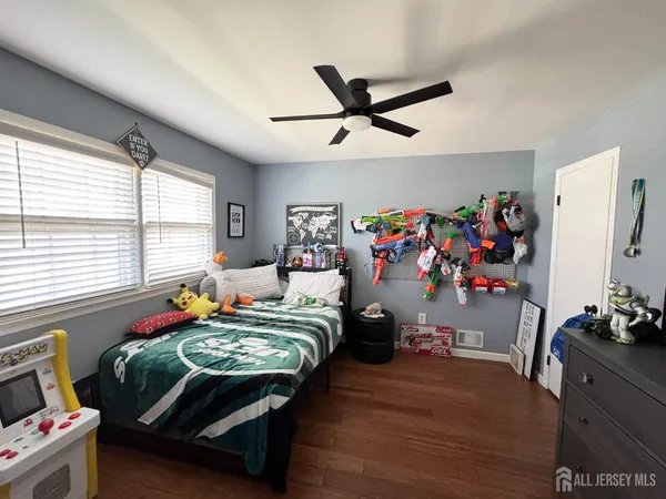 a bedroom with bed and a window