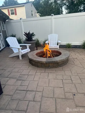 a view of a terrace with chair and white walls