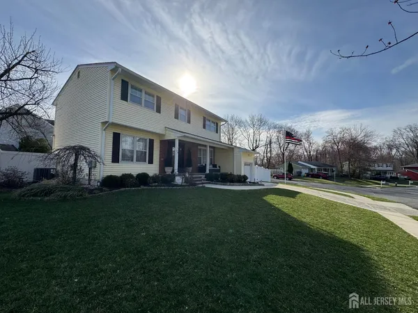 a front view of house with yard and outdoor seating