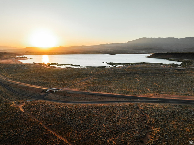 1693 Devils Gdn Lane Washington, UT 84780 - Photo 64 of 64 Expansive aerial landscape featuring a large lake, surrounding desert terrain, and distant mountains