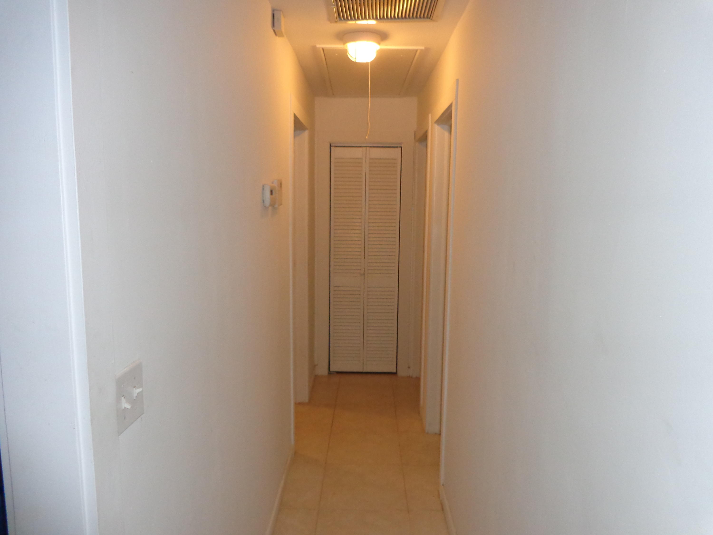 11075 Ellison Wilson Road North Palm Beach, FL 33408 - Photo 15 of 29 Hallway to bedrooms