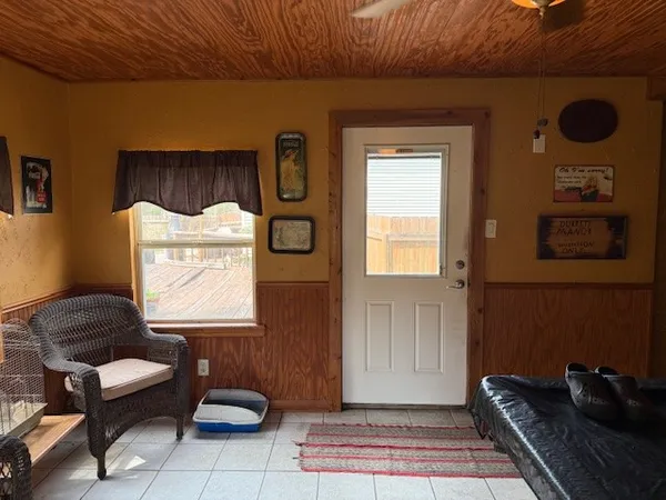 a living room with furniture and a window
