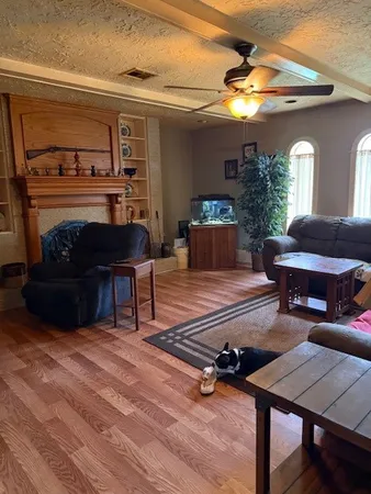 a living room with furniture and a fireplace
