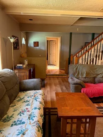 a bedroom with bed and a window