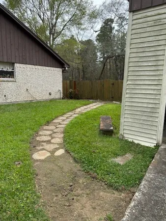 a view of a back yard of the house