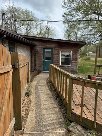 a front view of a house with a wooden floor
