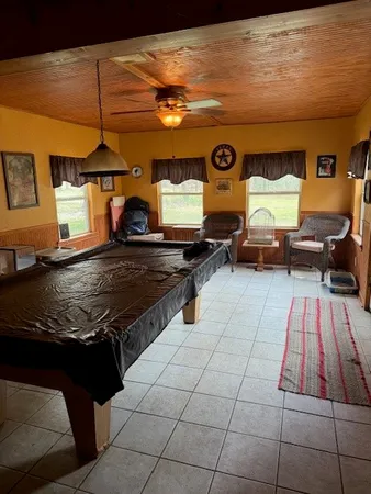 a living room with couch and a table