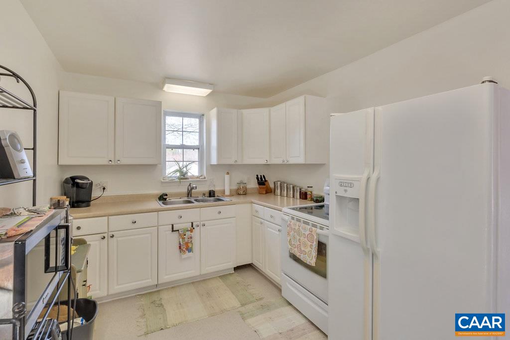 782 West Daffodil Road Ruckersville, VA 22968 - Photo 5 of 18 a kitchen with a sink stove and cabinets