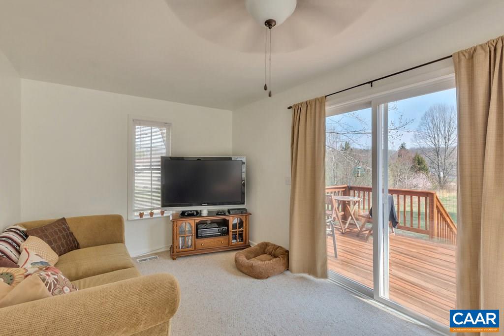782 West Daffodil Road Ruckersville, VA 22968 - Photo 8 of 18 a living room with furniture and a flat screen tv