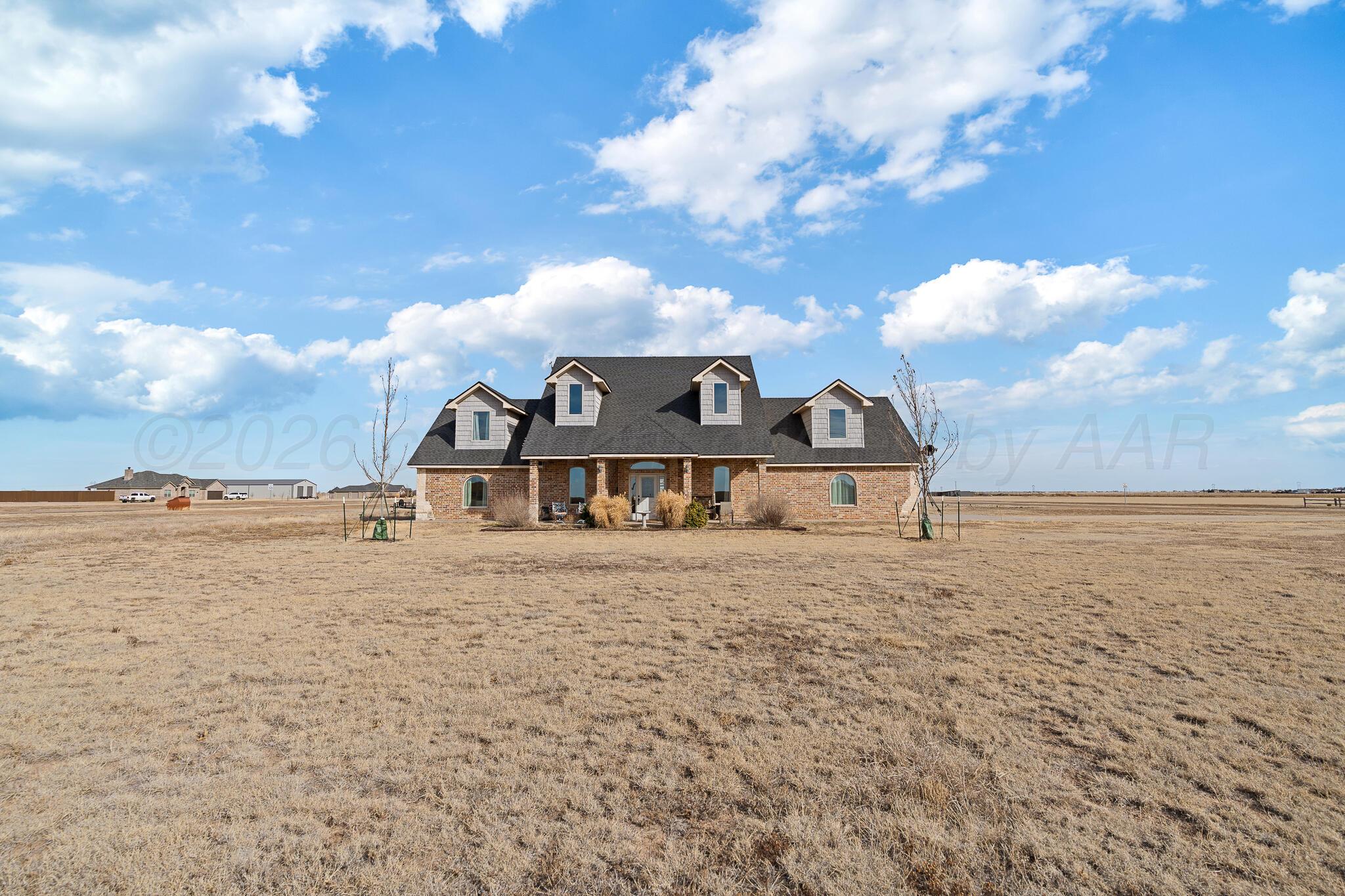 19000 Spirit Loop Amarillo, TX 79119 - Photo 4 of 86 a view of a big house with a big yard and large trees