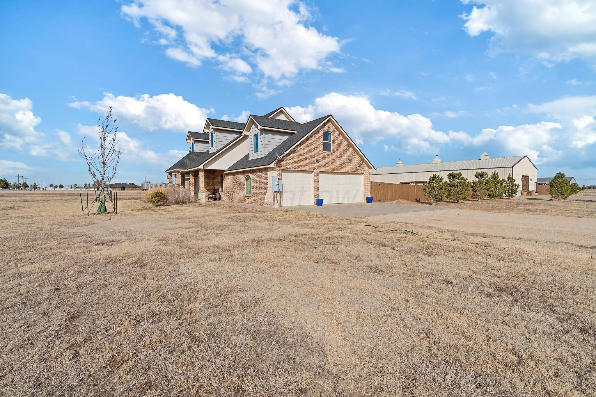 19000 Spirit Loop Amarillo, TX 79119 - Photo 5 of 86 a view of a house with a yard