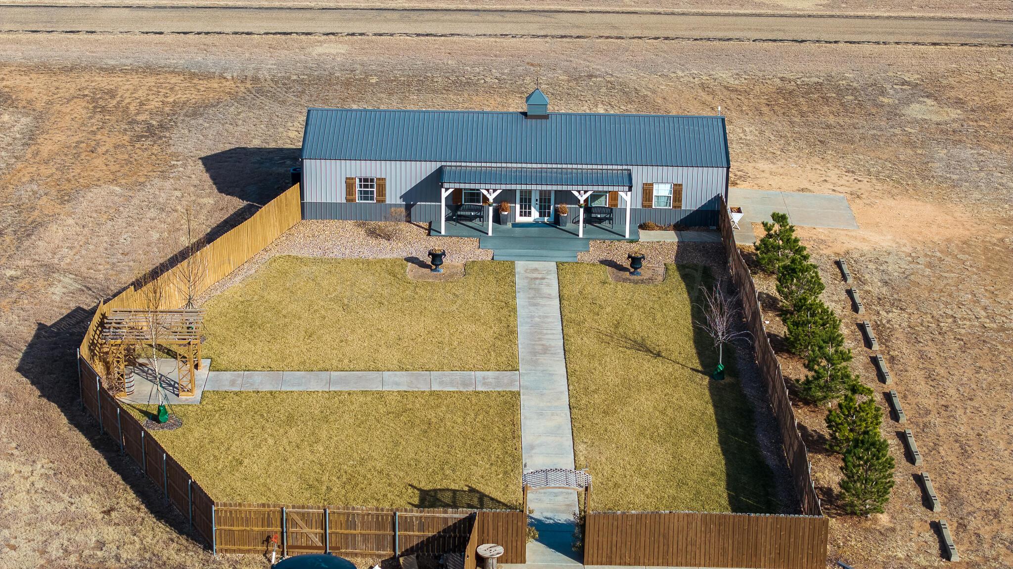 19000 Spirit Loop Amarillo, TX 79119 - Photo 60 of 86 a aerial view of a house with a swimming pool
