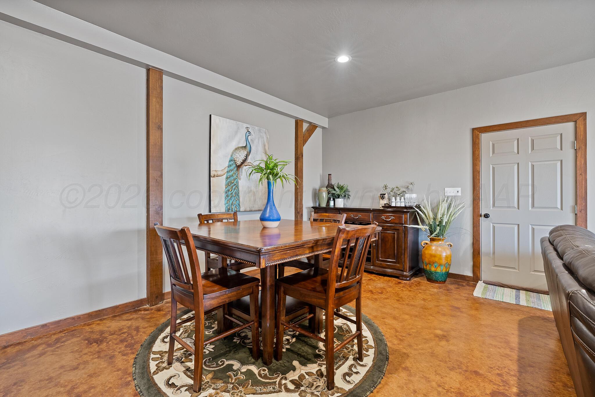 19000 Spirit Loop Amarillo, TX 79119 - Photo 66 of 86 a view of a dining room with furniture and a window