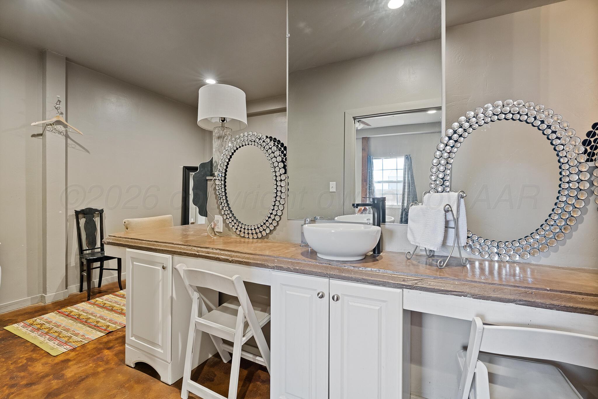 19000 Spirit Loop Amarillo, TX 79119 - Photo 71 of 86 a bathroom with a sink and a mirror