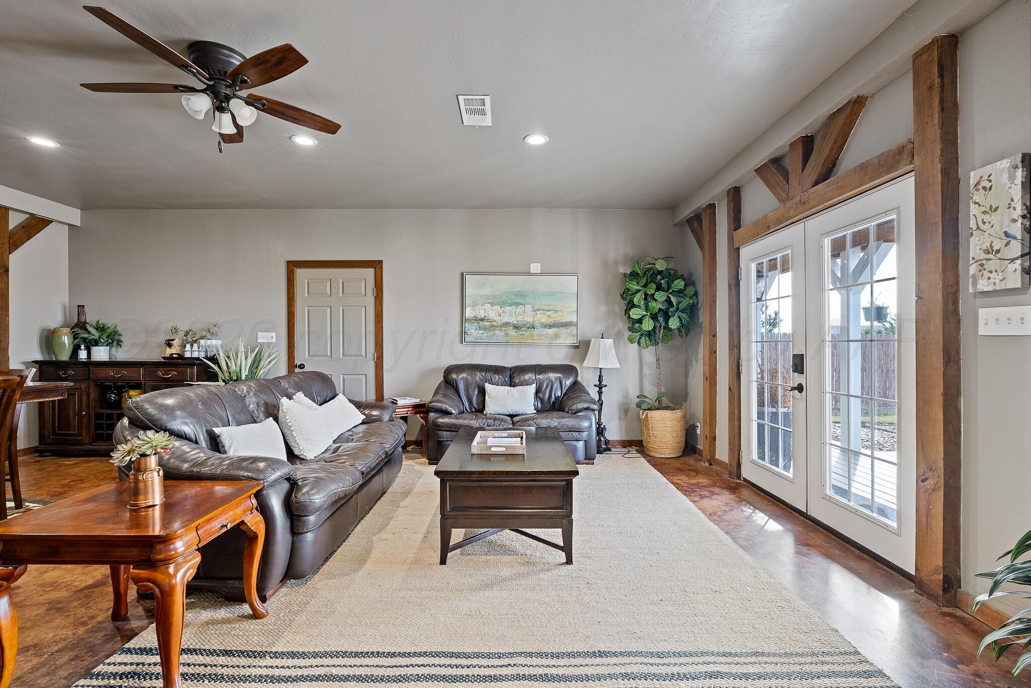 19000 Spirit Loop Amarillo, TX 79119 - Photo 79 of 86 a living room with furniture a ceiling fan and a rug