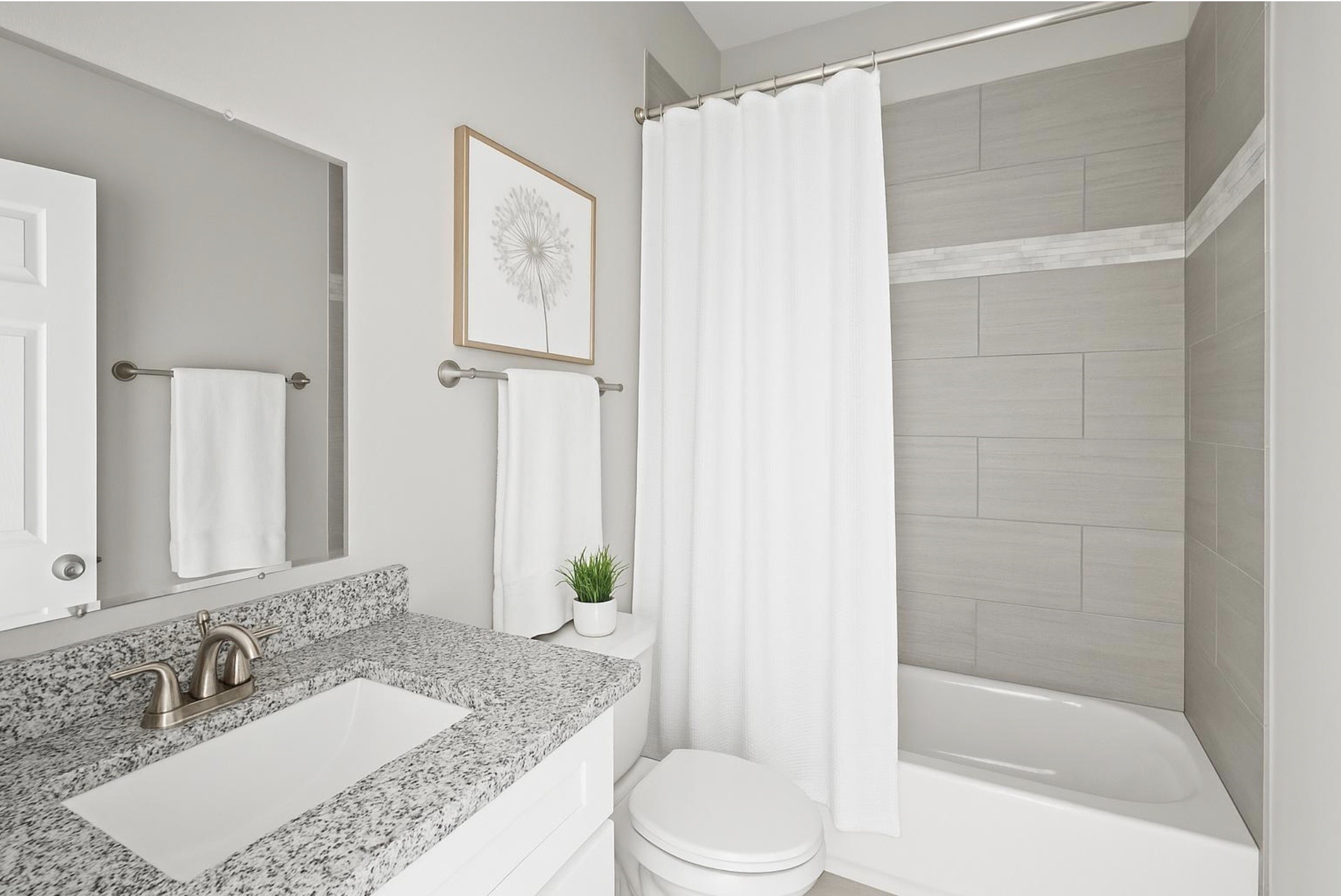 8204 Tower Street Houston, TX 77088 - Photo 12 of 24 a bathroom with a granite countertop sink a toilet and shower