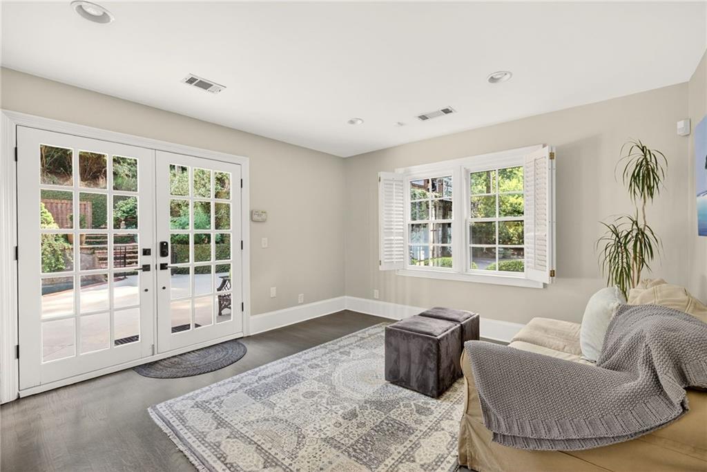 3650 Dumbarton Road Northwest Atlanta, GA 30327 - Photo 17 of 57 a living room with furniture and windows