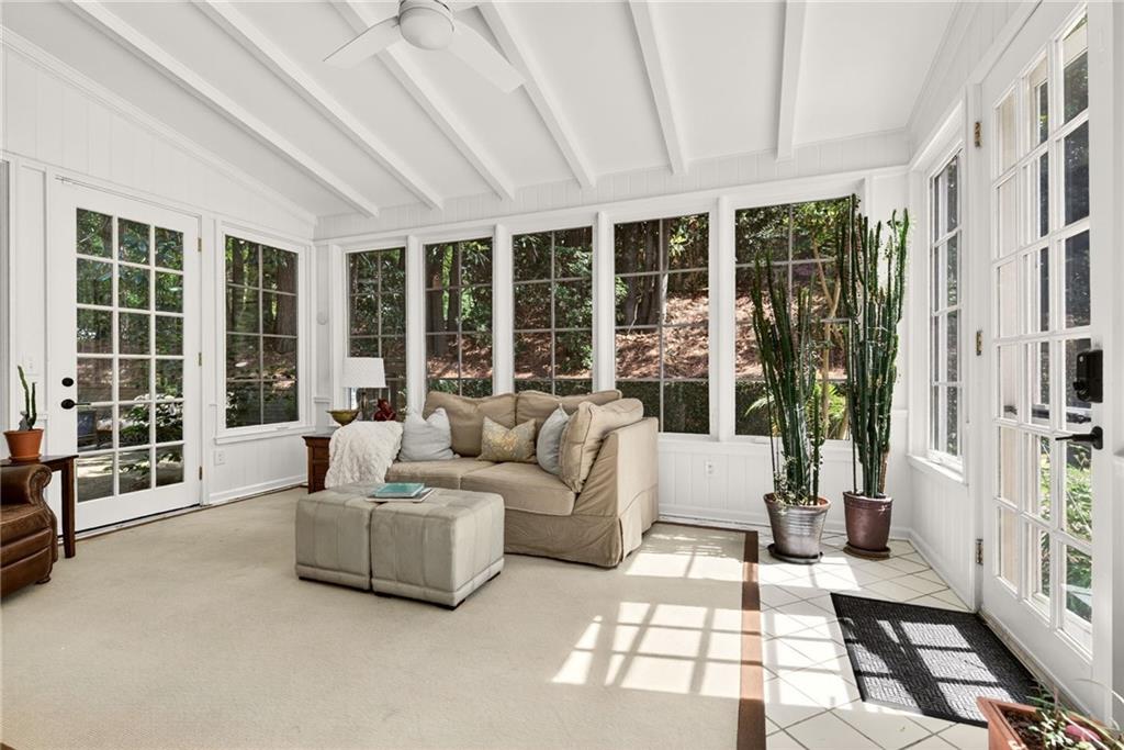 3650 Dumbarton Road Northwest Atlanta, GA 30327 - Photo 20 of 57 a living room with furniture and large windows